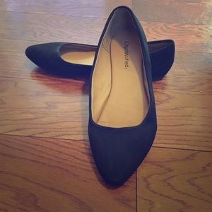 Black faux suede flats with slight pointed toe.